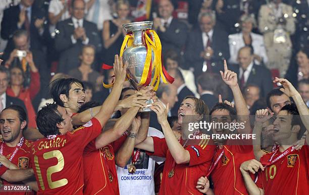 Players of the Spanish national football team hold up the Trophy after the Euro 2008 championships final football match Germany vs. Spain on June 29,...