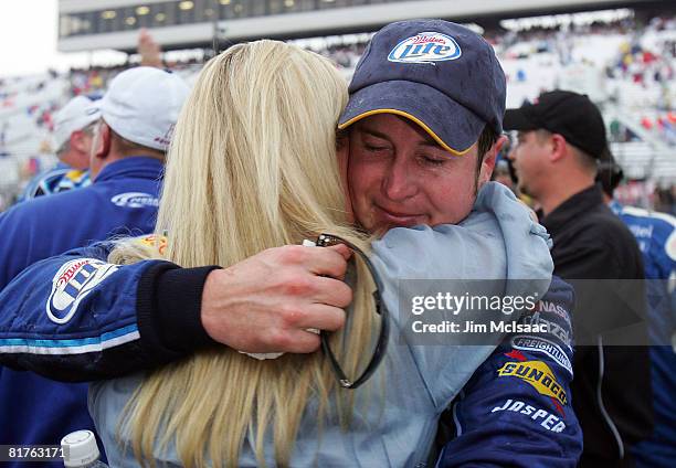 Kurt Busch, driver of the Miller Lite Dodge, celebrates with his wife Eva after winning the NASCAR Sprint Cup Series LENOX Industrial Tools 301 at...