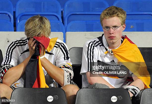 German supporters look dejected after Spain won the Euro 2008 championships final football match over Germany on June 29, 2008 at Ernst-Happel...