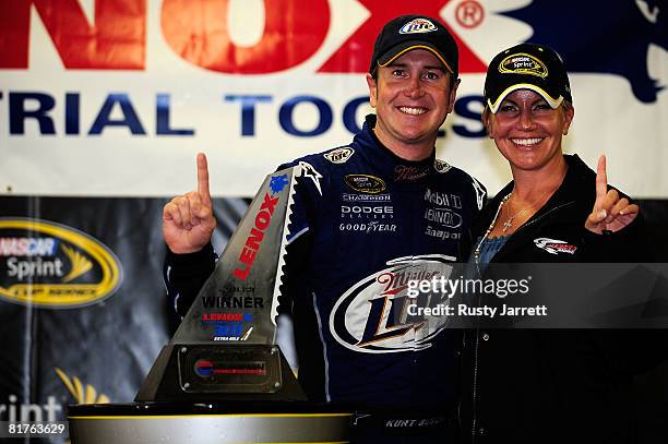 Kurt Busch , driver of the Miller Lite Dodge, celebrates in victory lane with his wife Eva , after winning the NASCAR Sprint Cup Series LENOX...