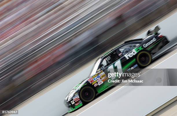 Denny Hamlin, driver of the FedEx Ground Toyota, races during the NASCAR Sprint Cup Series LENOX Industrial Tools 301 at New Hampshire Motor Speedway...