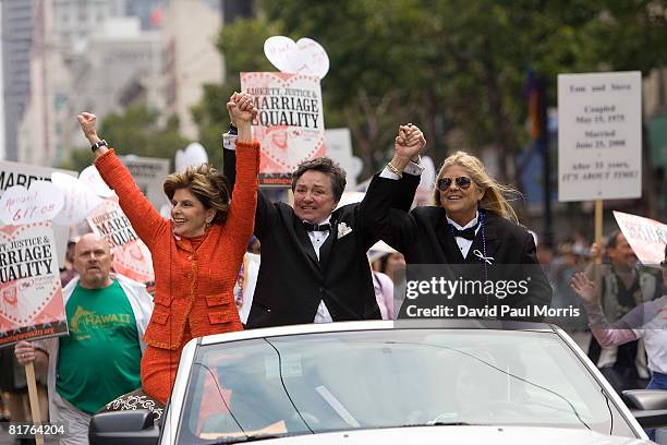 Attorney Gloria Allred holds hands with a lesbian couple, spouses Robin Tyler and Diane Olson as they take part in the 38th Annual San Francisco...