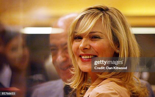 Sex In The City star Kim Cattrall opens the Harrods Summer sale with Mohamed Al Fayed at Harrods department store on June 30, 2008 in London, England.