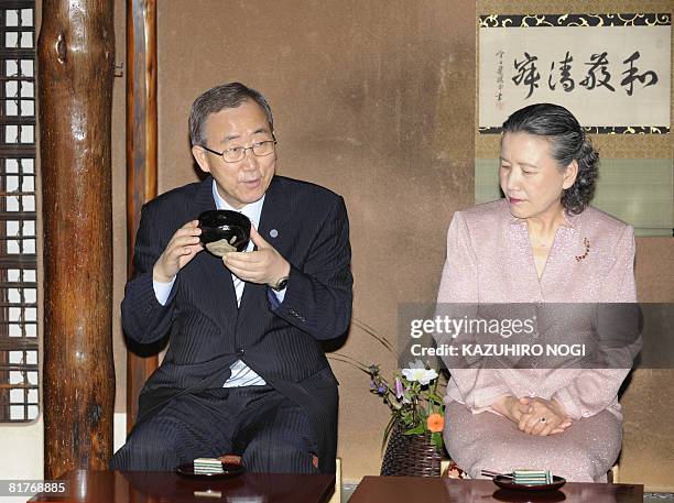 Secretary General Ban Ki-Moon , accompanied by his wife Yoo Soon-taek , drinks a cup of Japanese traditional tea during a welcoming tea ceremony at...