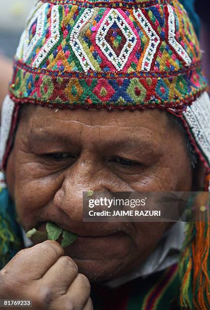 An Andean priest chews coca leaves during the celebration of the Indigenous Day and the winter solstice at a popular park in Lima on June 24, 2008....