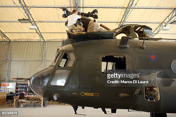 Chinook 27th Squadron Royal Air Force engineers, part of the Joint Helicopter Force, work on a Chinook helicopter on June 26, 2008 at their base at...