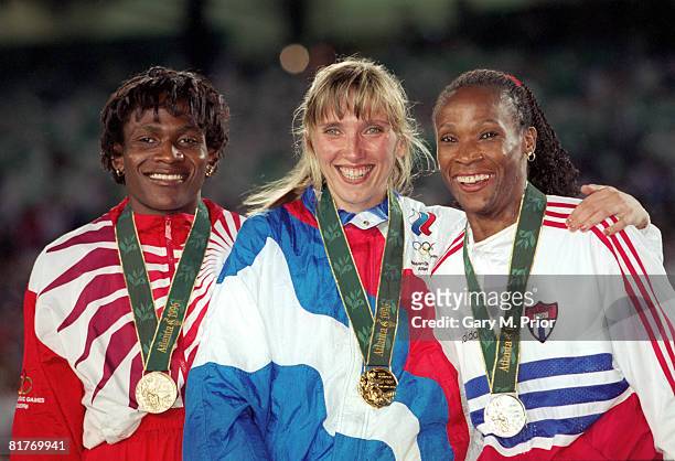 From left to right, Maria Mutola of Mozambique , Soviet athlete Svetlana Masterkova and Ana Fidelia Quirot of Cuba , winners of the women's 800...