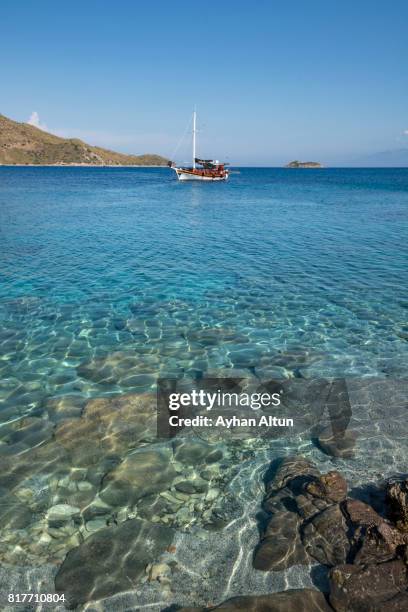 turquoise crystal waters of akyarlar in bodrum, mugla, aegean coast of turkey - bodrum turkey stock pictures, royalty-free photos & images