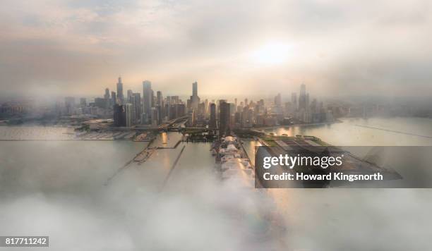 aerial view of chicago with misty sky - lake michigan stock pictures, royalty-free photos & images