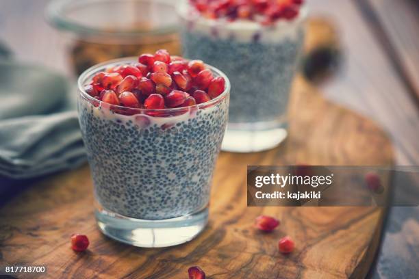 chia seed pudding with fresh pomegranates - pudding stock pictures, royalty-free photos & images