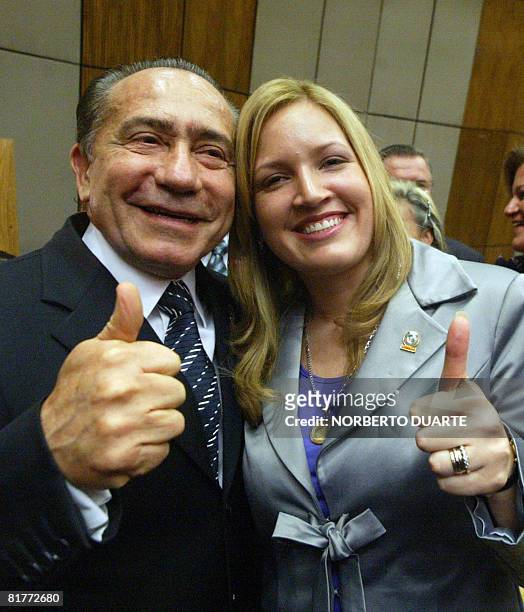 Former Paraguayan presidential candidate Lino Oviedo poses with his daughter Fabiola Oviedo, after she took oath as deputy at the National Congress...