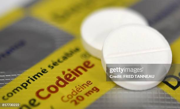 This photograph taken on July 18 shows pills which contain codeine in a pharmacy in Quimper, western France. - In France, Codeine-based medicines...