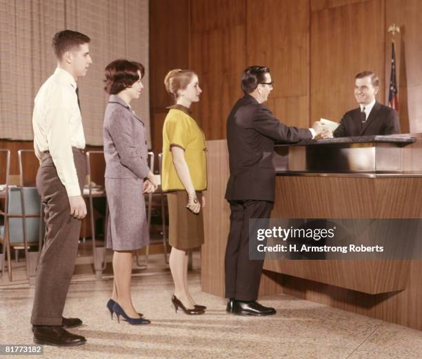 line people group waiting bank teller banking. - 1960 fotografías e imágenes de stock