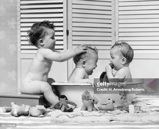 three babies in wash tub, bathing. - 1940s bathroom stock pictures, royalty-free photos & images