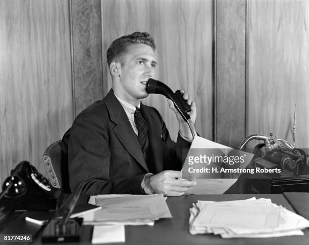 man at desk talking into dictaphone. - 小型テープレコーダー ストックフォトと画像