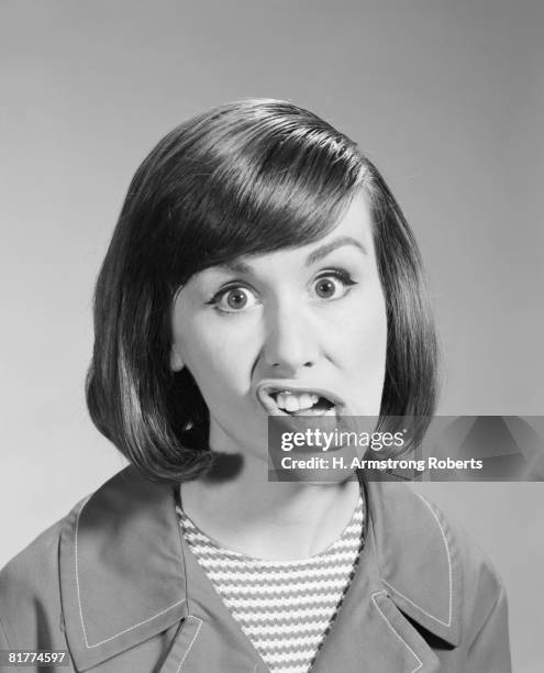 woman pulling silly facial expression, portrait. (photo by h. armstrong roberts/retrofile/getty images) - retrofile foto e immagini stock