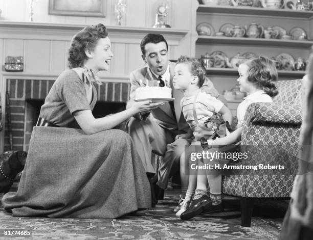 family celebrating son's birthday. - couple celebrating stockfoto's en -beelden