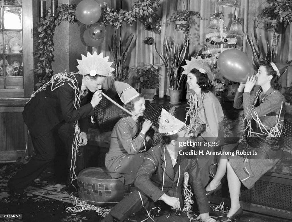 Group of men and women at party.