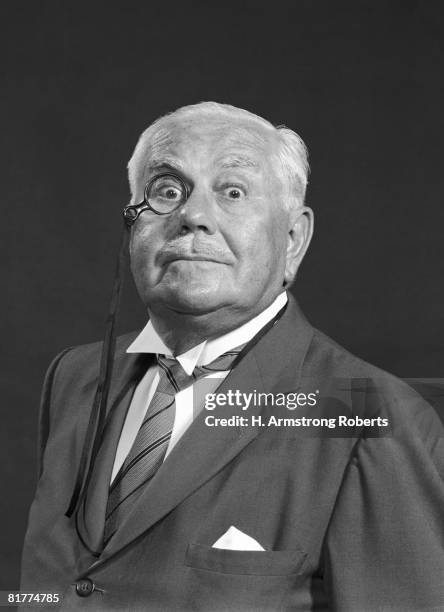 elderly man in formal jacket and tie, wearing monocle. - monocles stock pictures, royalty-free photos & images