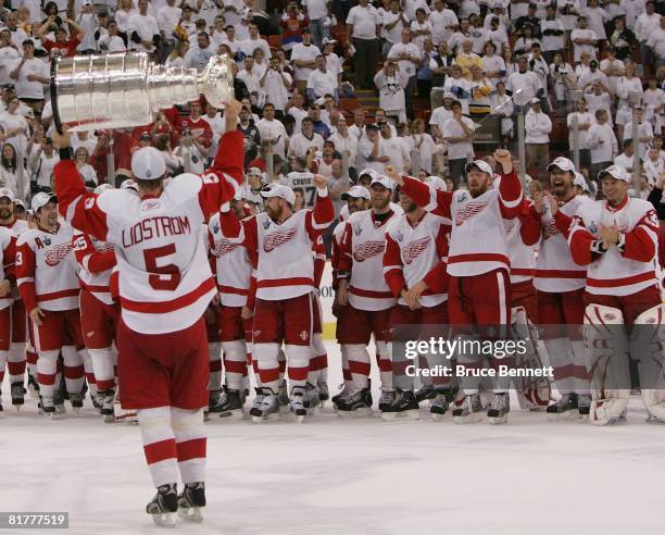 Nicklas Lidstrom of the Detroit Red Wings celebrates with the Stanley Cup after defeating the Pittsburgh Penguins in game six of the 2008 NHL Stanley...