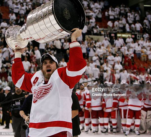 Henrik Zetterberg of the Detroit Red Wings celebrates with the Stanley Cup after defeating the Pittsburgh Penguins in game six of the 2008 NHL...