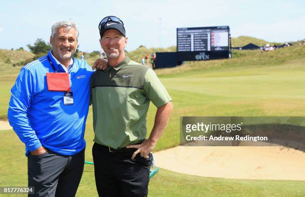 Golf Channel commentator Frank Nobilo of New Zealand with David Duval of the United States during a practice round prior to the 146th Open...