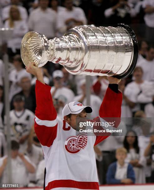 June 04: Nicklas Lidstrom of the Detroit Red Wings celebrates with the Stanley Cup after defeating the Pittsburgh Penguins in game six of the 2008...
