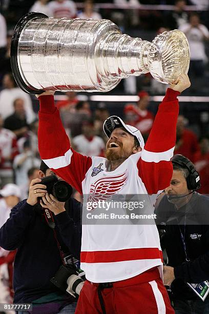 Mikael Samuelsson of the Detroit Red Wings celebrates with the Stanley Cup after defeating the Pittsburgh Penguins in game six of the 2008 NHL...