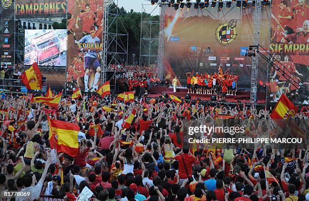 Spain's Euro 2008 football squad celebrate in the Plaza Colon in Madrid during a victory parade on June 30, 2008. Tens of thousands of supporters...