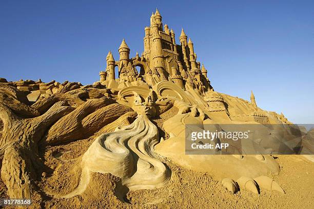 Sand sculpture sits at the opening night of the sand sculpture festival, on the beach of Blankenberge, on June 30, 2008. This year's edition of the...