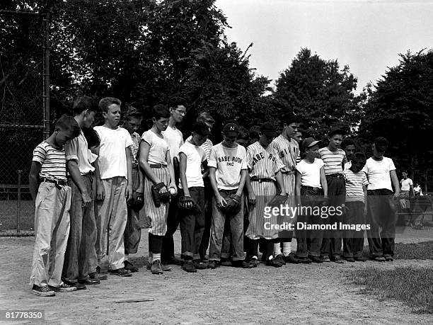 Young ballplayers pause to bow their heads in memory of their idol Babe Ruth on August 18, 1948 in Newark, New Jersey. Babe Ruth passed away on...