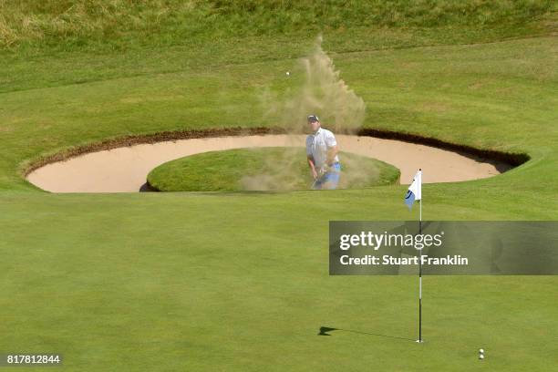 Richie Ramsay of Scotland hits a bunker shot on the 7th hole during a practice round prior to the 146th Open Championship at Royal Birkdale on July...