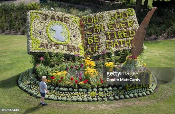 Boy looks at a floral tribute to the author Jane Austen who died 200 years ago today, that has been created in the Parade Gardens on July 18, 2017 in...
