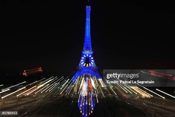 The Eiffel Tower is illuminated in blue with gold stars, representing the EU flag, to mark the French European Union presidency on June 30, 2008 in...