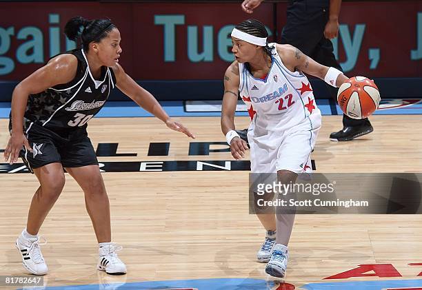 Betty Lennox of the Atlanta Dream looks to maneuver against Helen Darling of the San Antonio Silver Stars during the WNBA game on June 18, 2008 at...