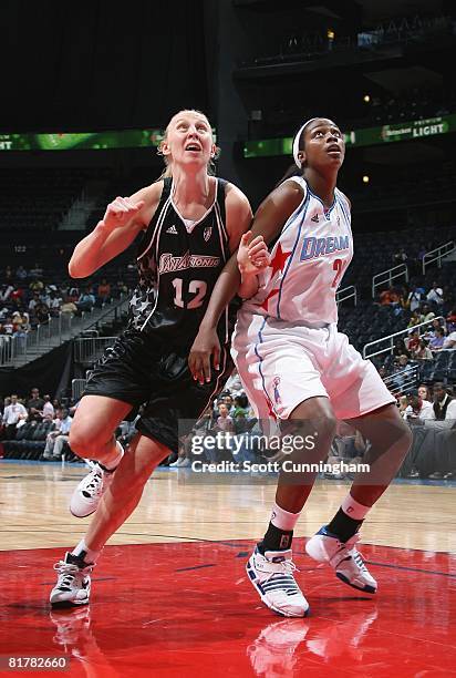 Ann Wauters of the San Antonio Silver Stars gets in position to rebound against Camille Little of the Atlanta Dream during the WNBA game on June 18,...