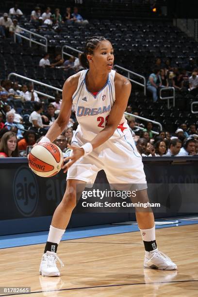 Tamera Young of the Atlanta Dream looks to pass the ball against the San Antonio Silver Stars during the WNBA game on June 18, 2008 at Philips Arena...