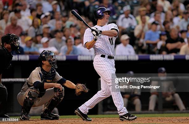 Brad Hawpe of the Colorado Rockies watches his three-run homerun off of starting pitcher Greg Maddux of the San Diego Padres which gave the Rockies a...