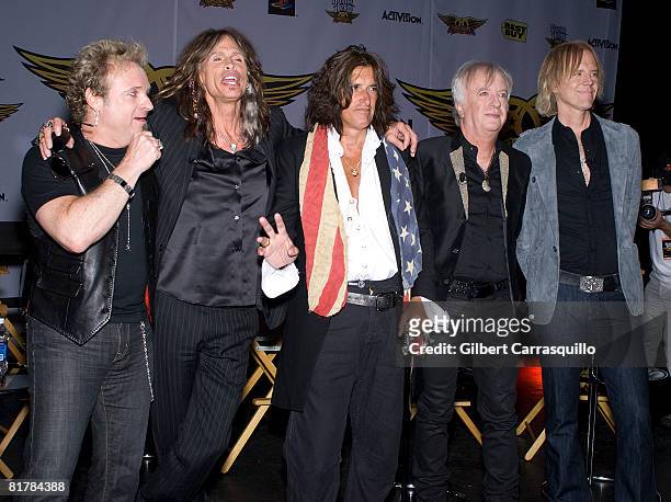 Joey Kramer, Steven Tyler, Joe Perry, Brad Whitford and Tom Hamilton attend the launch of Guitar Hero Aerosmith at the Hard Rock Caf? on June 27,...