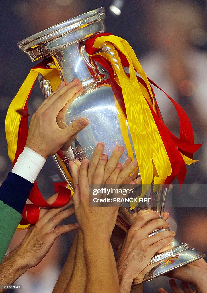 Spanish players hold the trophy as they