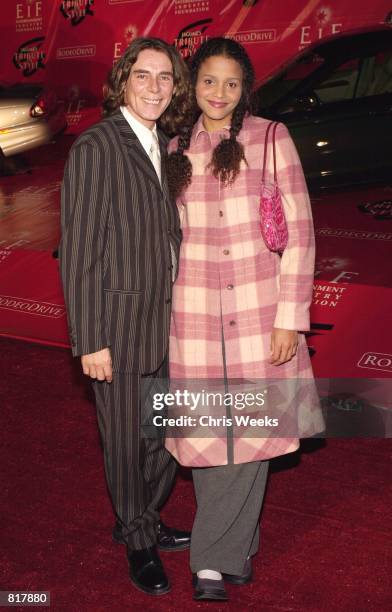 Fashion designer George Blodwell and actress Sydney Tamiia Poitier arrive at Jaguar's Tribute to Style March 18, 2001 in Santa Monica, CA.