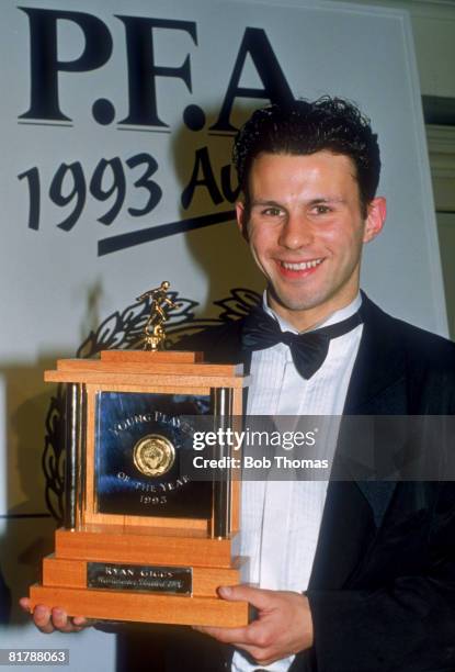 Manchester United footballer Ryan Giggs wins the Young Player of the Year trophy at the PFA Awards in London, 28th March 1993.
