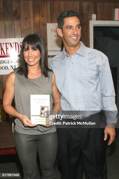 Laura Posada and Jorge Posada attend Jorge Posada and Laura Posada book signing of "The Beauty of Love" at BookEnds on September 23, 2010.