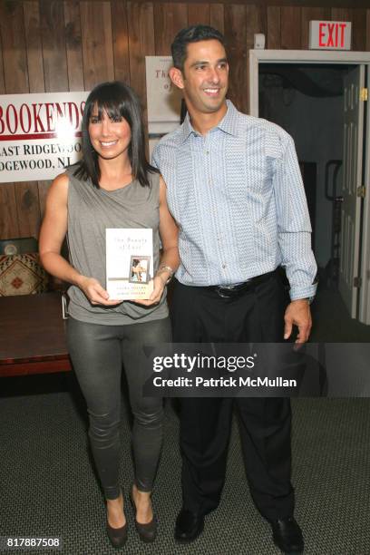 Laura Posada and Jorge Posada attend Jorge Posada and Laura Posada book signing of "The Beauty of Love" at BookEnds on September 23, 2010.