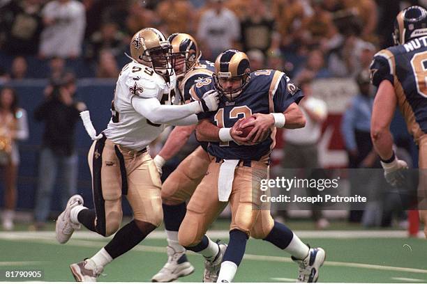 Linebacker Keith Mitchell of the New Orleans Saints sacks quarterback Kurt Warner of the St. Louis Rams in the 2000 NFC Wild Card Game at the...
