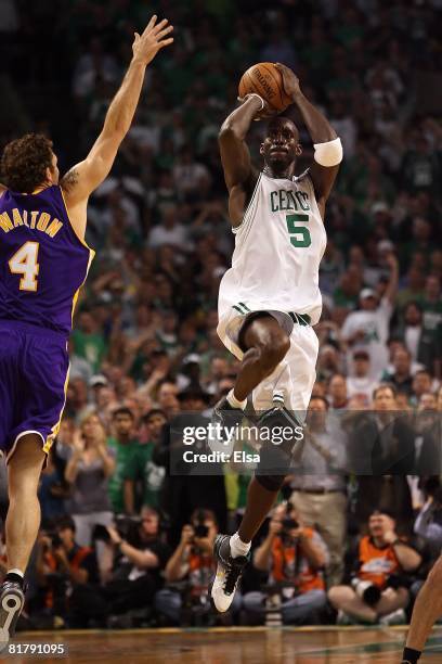 Kevin Garnett of the Boston Celtics shoots a jumper over Luke Walton of the Los Angeles Lakers in Game Six of the 2008 NBA Finals on June 17, 2008 at...