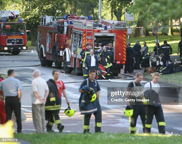 Firemen are seen at the burnt down tower block on July 1, 2008 in Erkrath near Duesseldorf, Germany. Three persons injured, one heavily, said a...