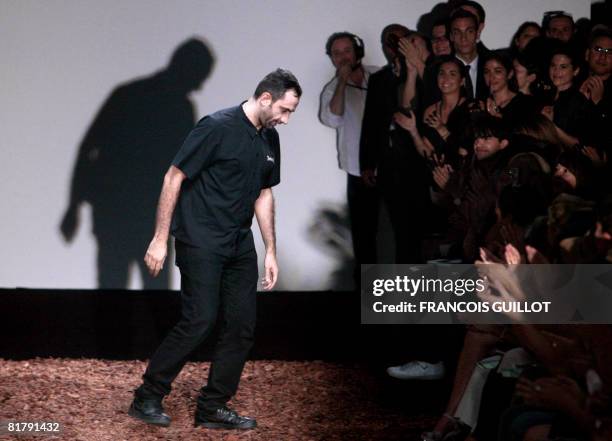 Italian designer Riccardo Tisci is applauded at the end of Givenchy Fall-Winter 2009 Haute Couture collection show in Paris on July 1, 2008. AFP...