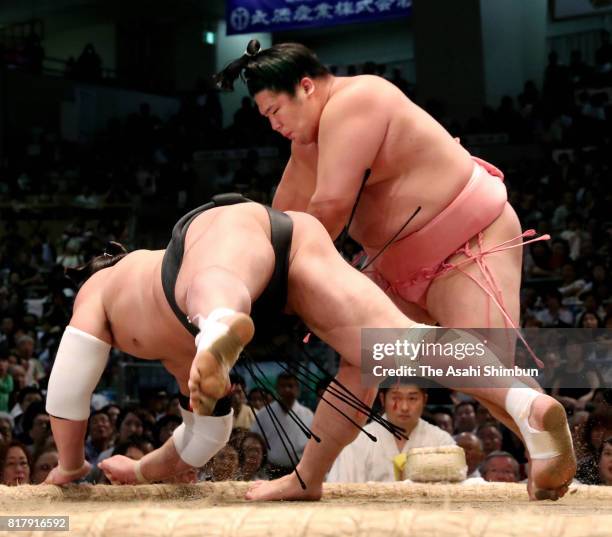 Ura throws Mongolian yokozuna Harumafuji to win during day nine of the Grand Sumo Nagoya Torunament at Aichi Prefecture Gymnasium on July 17, 2017 in...