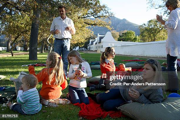 Waiter carries a grape and cheese platter during a birthday party on May 26, 2007 at Groot Constantia, South Africa's oldest vine yard outside Cape...
